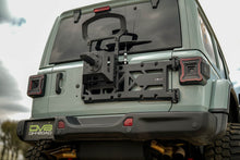 Load image into Gallery viewer, DV8 Offroad 18-25 Jeep Wrangler JL Spare Tire Carrier